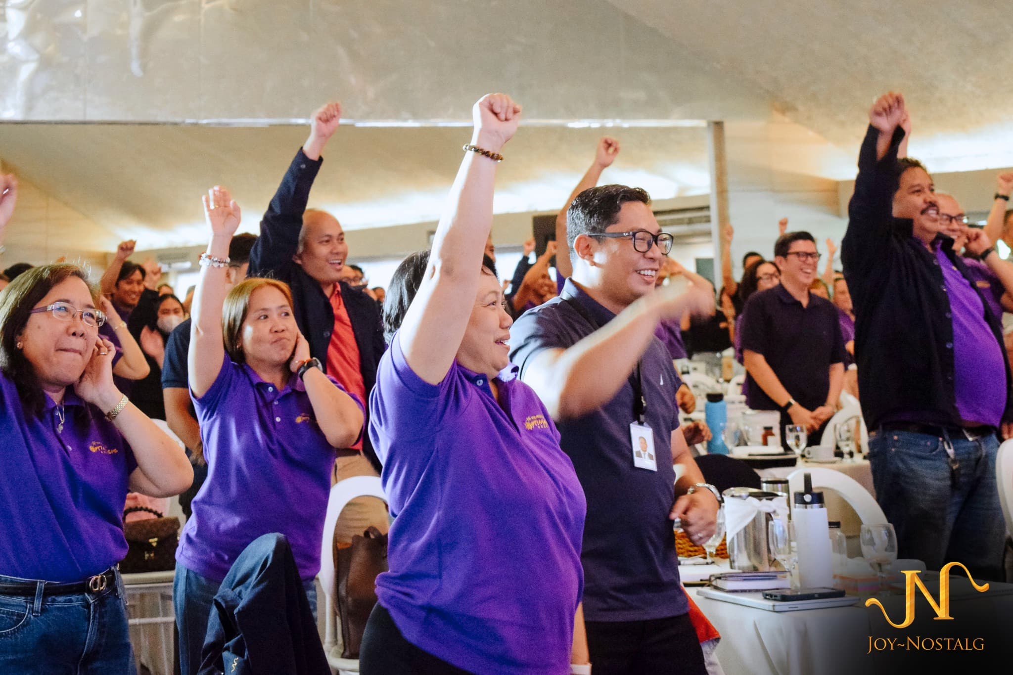 Joy~Nostalg employees celebrating together at an event