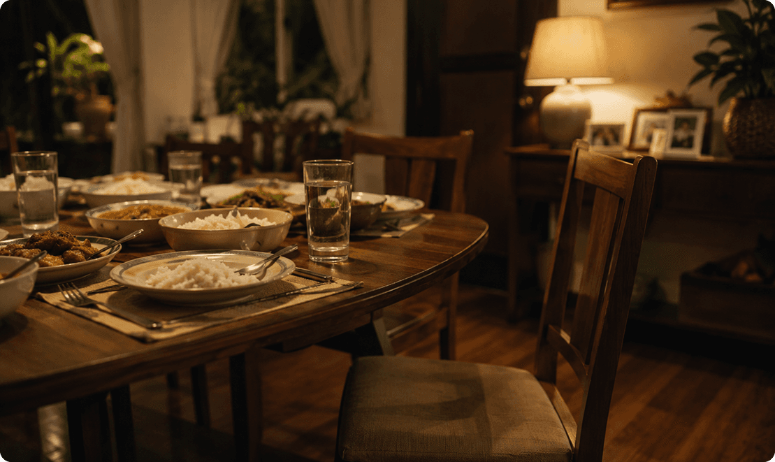 An empty chair at a family dinner table