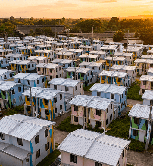 Aerial view of a Philippine housing community at sunset